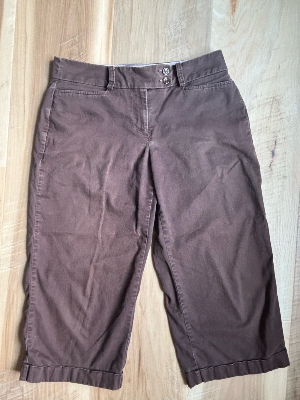 vintage faded glory low rise boot cut jeans with distressed details.